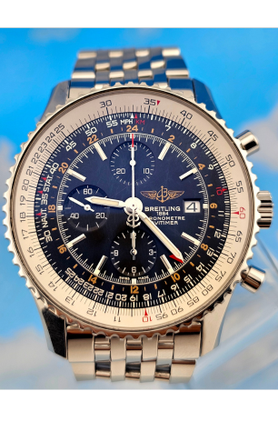 Breitling Navitimer World chronograph watch with a blue dial, stainless steel case, and bracelet, featuring a slide rule bezel and date display.
