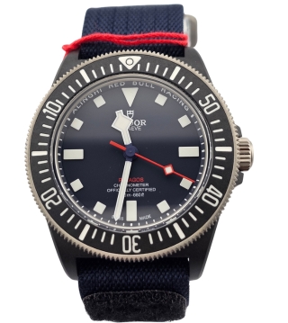 Tudor Pelagos Red Bull Racing diving watch with black dial, bold luminous markers, titanium bezel, and red accents on the second hand.